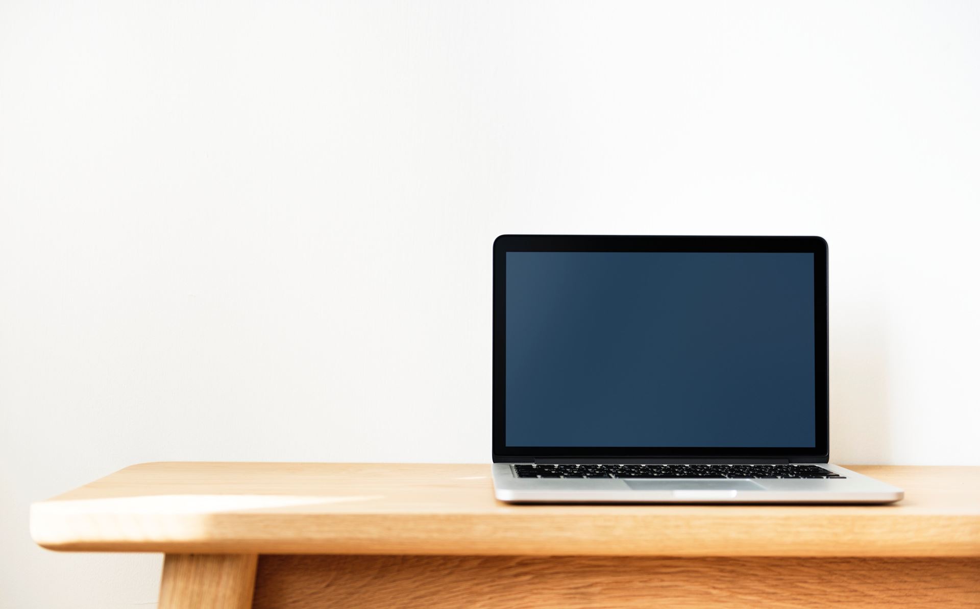 a desktop computer sitting on top of a wooden table